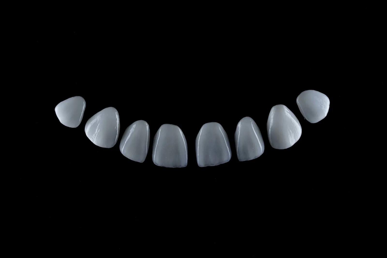 Eight porcelain veneers, ready for bonding